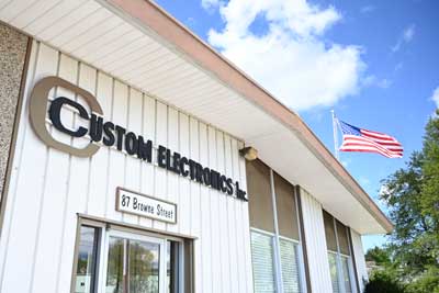 Custom Electronics Inc. Exterior with American flag